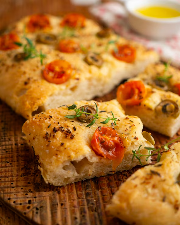 Homemade focaccia with tomatoes and olives